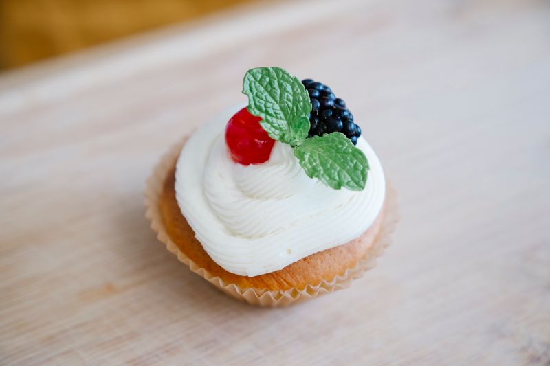 Tres leches cake with whipped cream and strawberries